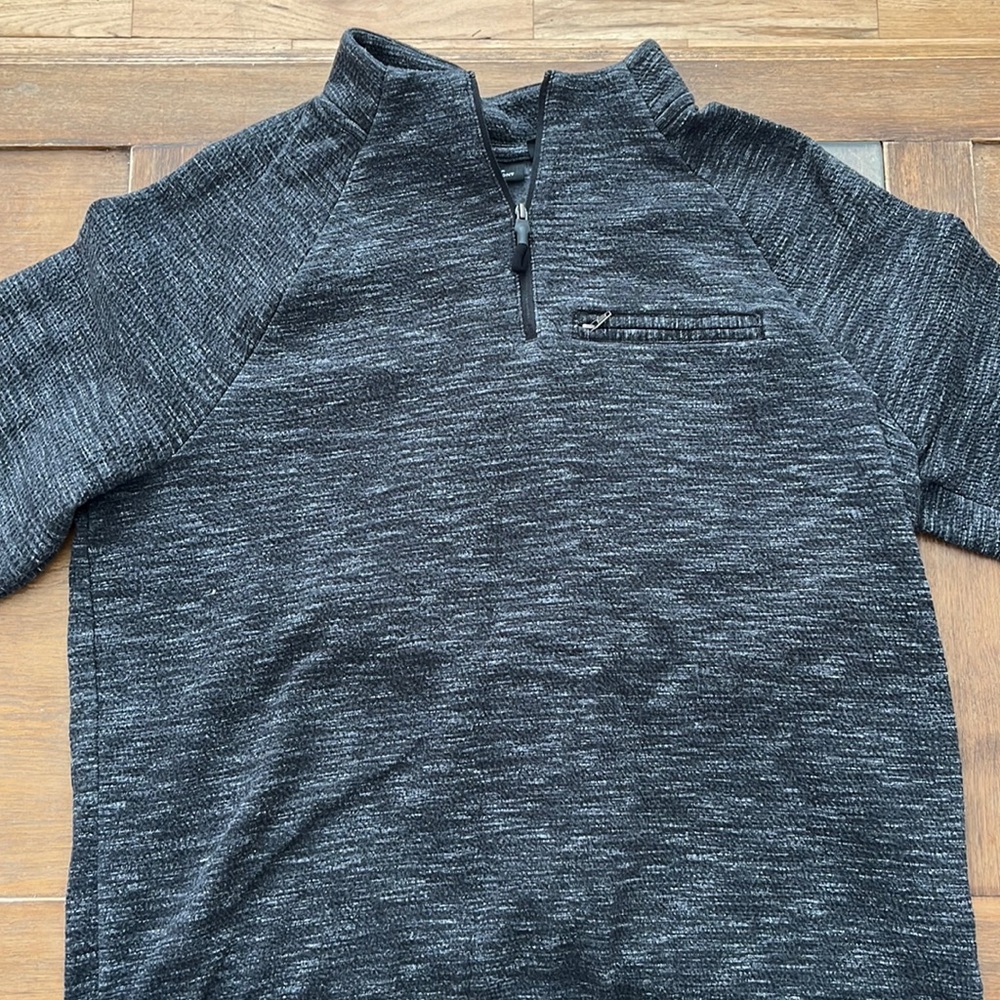 Dark grey casual crew neck sweater.